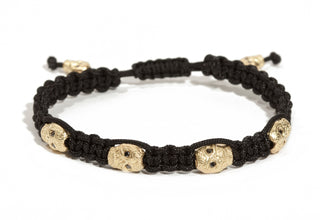 Men's bracelet with gold skulls