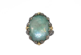 OVAL EMERALD AND CRIVELLI STATEMENT RING